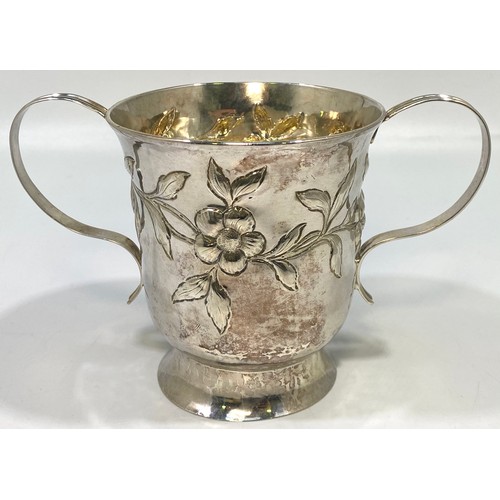 106 - An George III silver and silver-gilt two-handled porringer by Benjamin Bickerton, embossed and chase... 