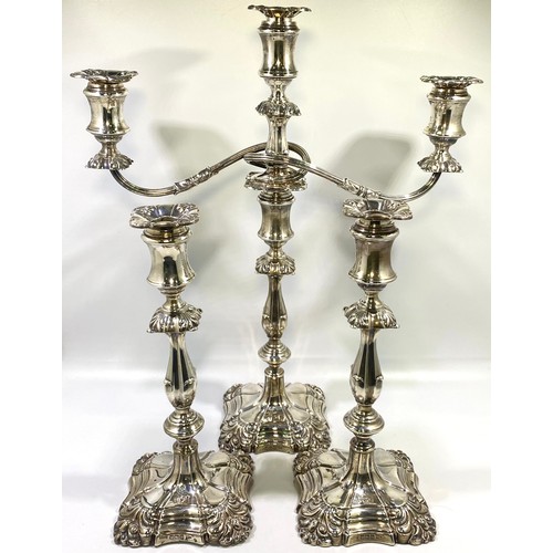 108 - A matching silver candelabrum suite by Walker & Hall, comprising three-light candelabrum and two can... 