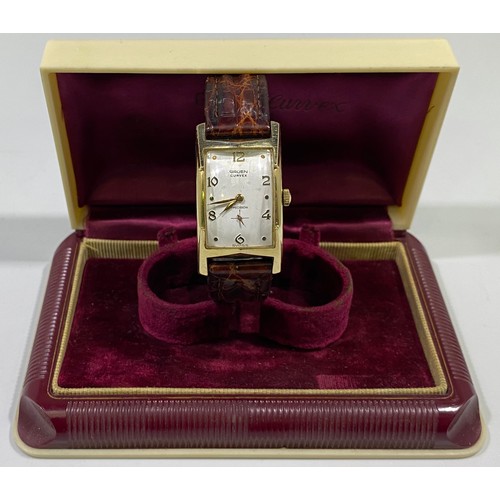 177 - A gold-plated Gruen 'Curvex' wristwatch, the curved, rectangular white dial with alternating Arabic ... 