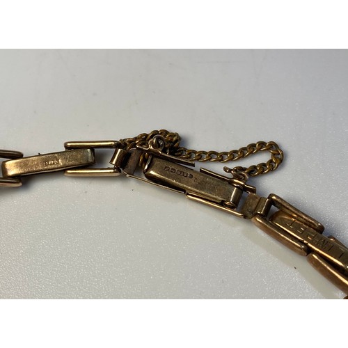 181 - A 9ct gold cased mid-size wristwatch, with black enamel dial, Arabic numerals denoting hours and sub... 