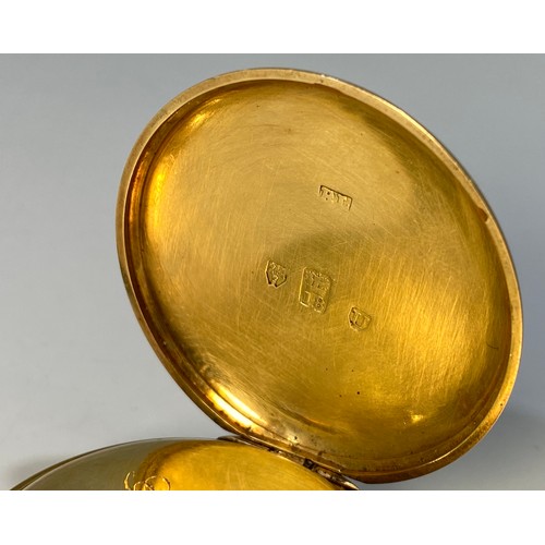 183 - An 18ct gold open-face pocket watch, the decorative, gilt, scrolled dial with Roman numerals denotin... 