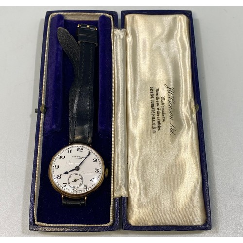 178 - A 9ct gold cased wristwatch, possibly a converted fob watch, by J. W. Benson, the white enamel dial ... 