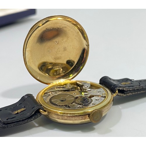 178 - A 9ct gold cased wristwatch, possibly a converted fob watch, by J. W. Benson, the white enamel dial ... 