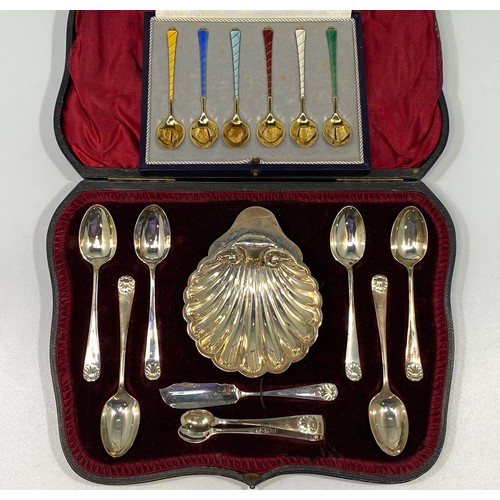 116 - A set of six Danish silver-gilt and enamel teaspoons each with different coloured enamel, boxed, tog... 