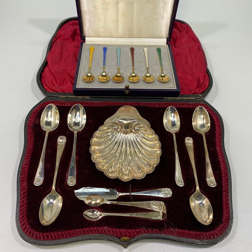 116 - A set of six Danish silver-gilt and enamel teaspoons each with different coloured enamel, boxed, tog... 