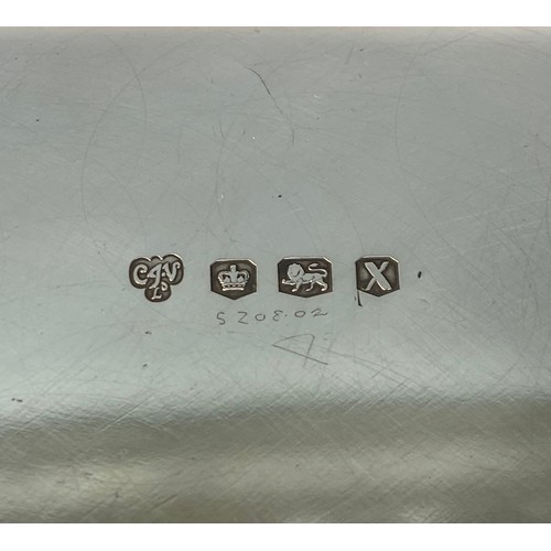 162 - A ERII silver salver of square form with serpentine canted corners, pie-crust rim raised on four scr... 