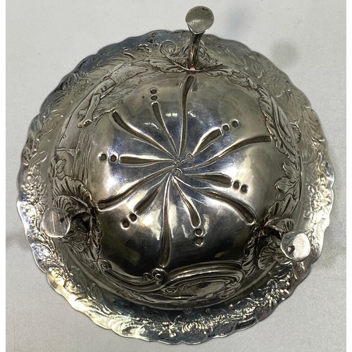 164 - A George III Irish silver sugar bowl or bon-bon of circular form with everted rim, embossed and chas... 