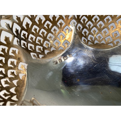 157 - A George V silver break basket, of lobed oval form with cast and applied scrollwork rim, pierced fle... 