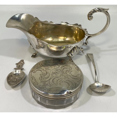 159 - A George III Irish silver sifting spoon, (marks rubbed), together with a Dutch silver caddy spoon wi... 