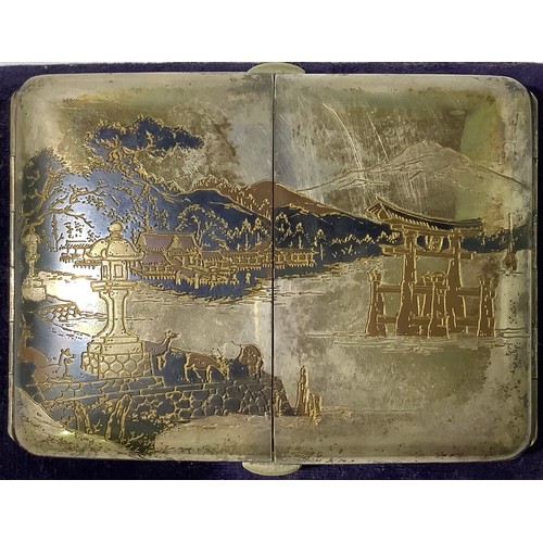 113 - A Japanese silver and niello worked cigarette case with double flip out front, engraved inside and o... 