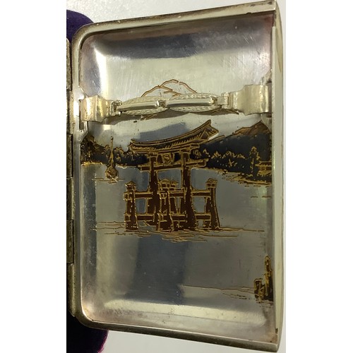 113 - A Japanese silver and niello worked cigarette case with double flip out front, engraved inside and o... 