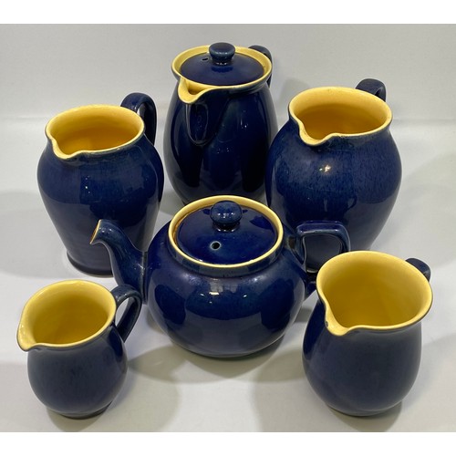 4 - A vintage Denby Cottage blue glazed teapot, coffee pot and four graduated jugs (6)