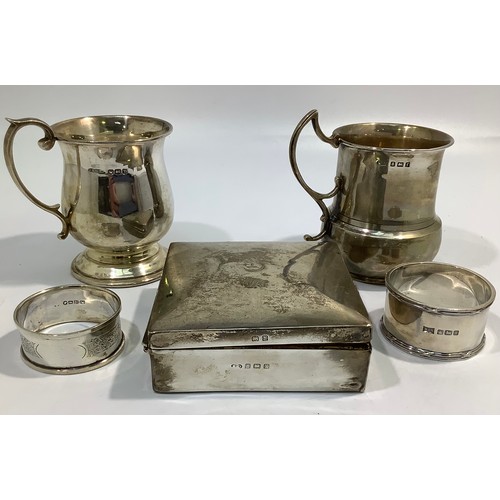 148 - A small collection of assorted silver items including a cigarette box, two small tankards including ... 