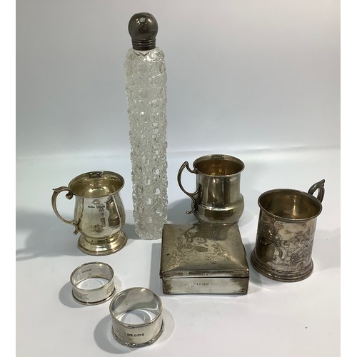 148 - A small collection of assorted silver items including a cigarette box, two small tankards including ... 