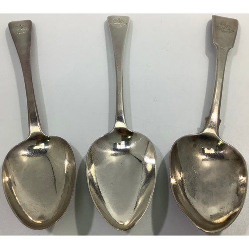 153 - Three Georgian silver old English and fiddle pattern serving spoons, including one by William Woodma... 
