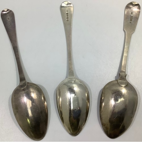 153 - Three Georgian silver old English and fiddle pattern serving spoons, including one by William Woodma... 