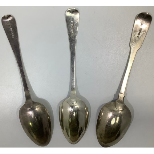 153 - Three Georgian silver old English and fiddle pattern serving spoons, including one by William Woodma... 