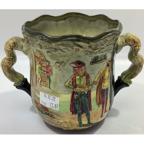 5 - A Royal Doulton twin-handled jug / loving cup decorated as 'The Apothecary' designed by Charles Noke... 