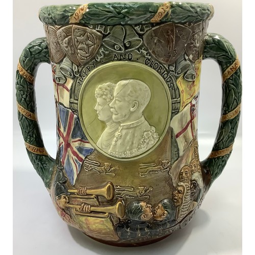 6 - A Royal Doulton twin-handled loving cup to celebrate the Silver Jubilee of His Majesty King George V... 