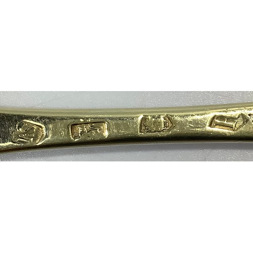 155 - A matched set of four mid-18th century silver bright-cut and later gilded berry spoons, various make... 