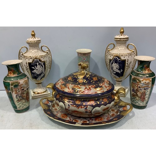 59 - A pair of pâte-sur-pâte decorated urns with covers in the style of Marc-Louis Solon, classically sha... 