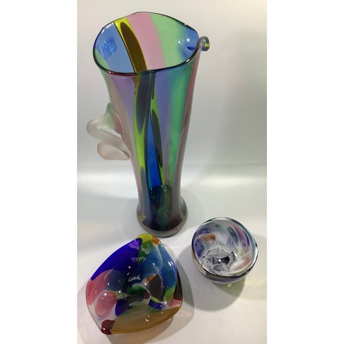 32 - A large Will Shakspeare glass stylised jug with tapered multi-coloured body and applied opaque glass... 