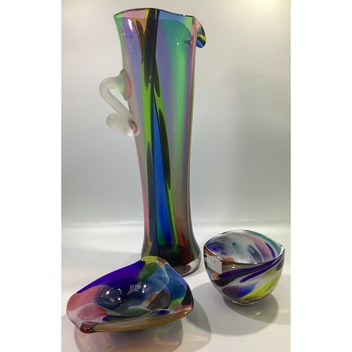 32 - A large Will Shakspeare glass stylised jug with tapered multi-coloured body and applied opaque glass... 