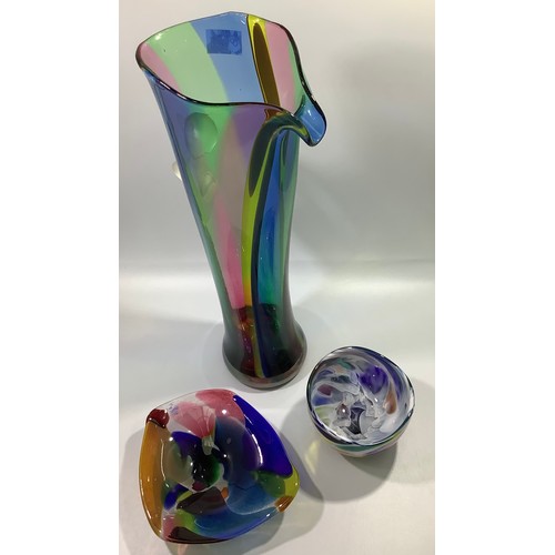 32 - A large Will Shakspeare glass stylised jug with tapered multi-coloured body and applied opaque glass... 