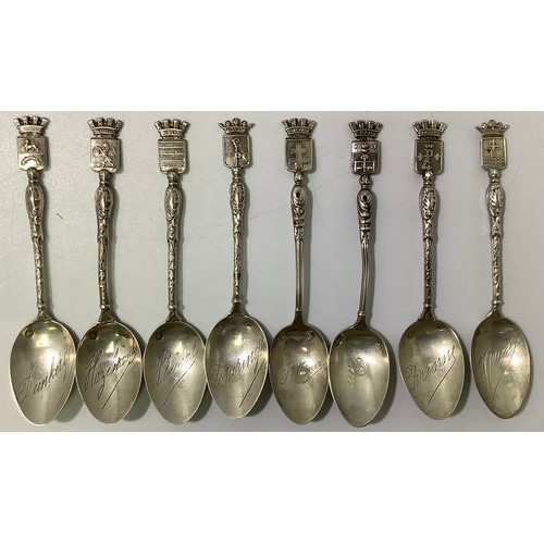144 - A collection of assorted French .800 grade or above silver topographical teaspoons, together with fo... 