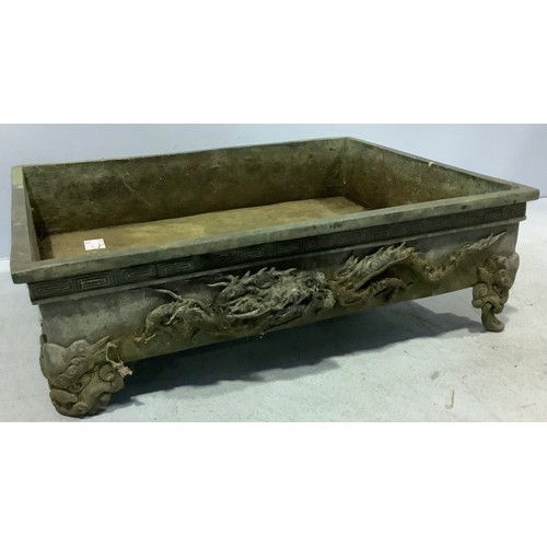 96 - A Chinese cast metal shallow planter / trough with applied dragons (one foot af)