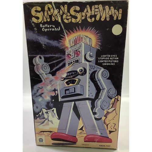 A Haha Toy battery operated Smoking Spaceman toy robot, boxed