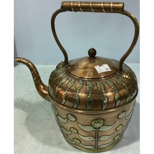 404 - A Middle Eastern copper kettle with silvered white metal and brass inlay embellishment of flowers an... 