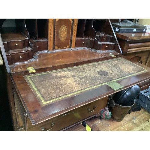 620 - A George III mahogany bureau with fall-front enclosing compartments, pigeon holes and secret compart... 