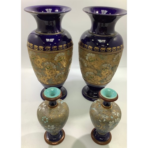 2 - Two pairs of Royal Doulton stoneware vases with gilt decoration to dark blue ground, largest pair 35... 