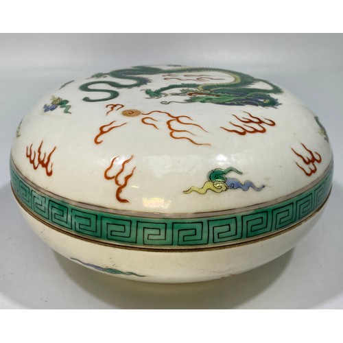 98 - A Chinese Qing Dynasty famille vert porcelain box and cover, of compressed circular form and decorat... 