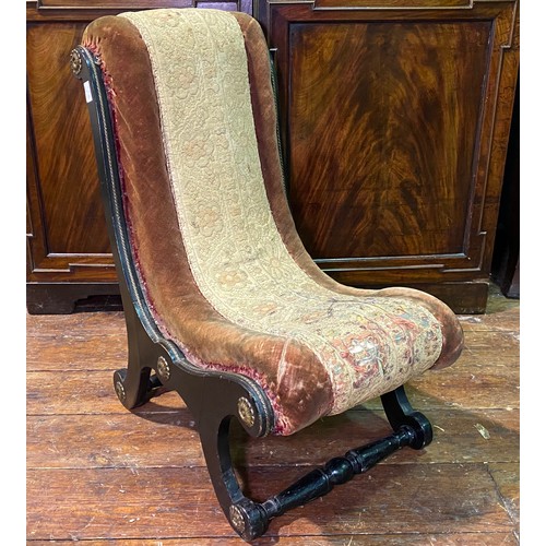 611 - A Victorian slipper chair of small proportions, with ‘X’ frame and turned front and back stretchers