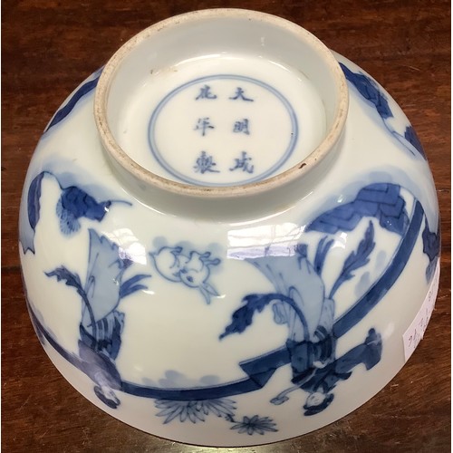 95 - A Chinese porcelain blue and white bowl decorated with ladies in a walled garden with a rabbit, Chen... 