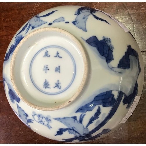 95 - A Chinese porcelain blue and white bowl decorated with ladies in a walled garden with a rabbit, Chen... 