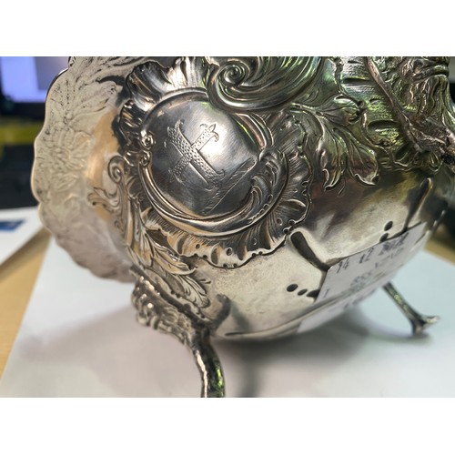 164 - A George III Irish silver sugar bowl or bon-bon of circular form with everted rim, embossed and chas... 