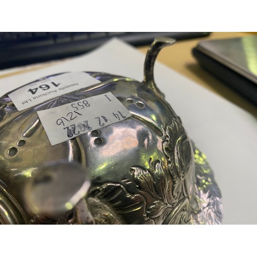 164 - A George III Irish silver sugar bowl or bon-bon of circular form with everted rim, embossed and chas... 