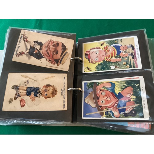 255 - A small modern album containing approximately 130 standard-size novelty cards, including a woven in ... 