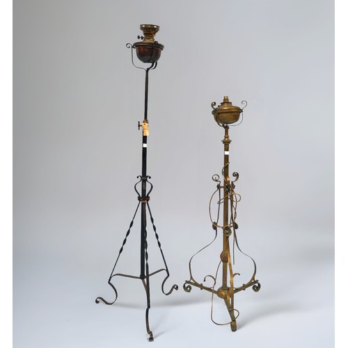 400 - Two various Arts & Crafts style wrought iron oil lamp stand converted to electric, with adjustable s... 