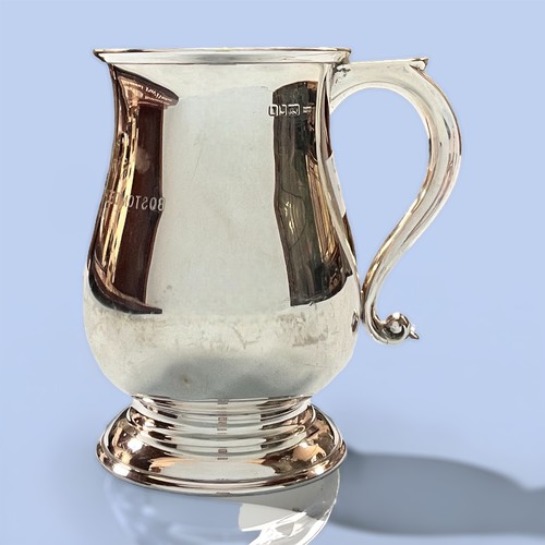77 - A silver tankard of baluster form by S J Rose & Son, with scrolled handle and inscription, ‘Presente... 