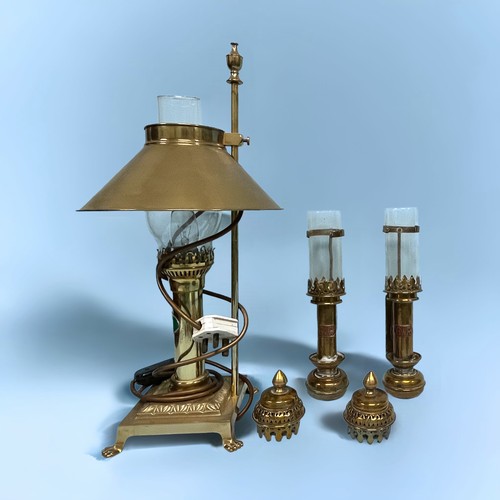 401 - A reproduction brass ‘Orient Express’ table light, stylised as an oil lamp, claw feet to base, 50cm ... 