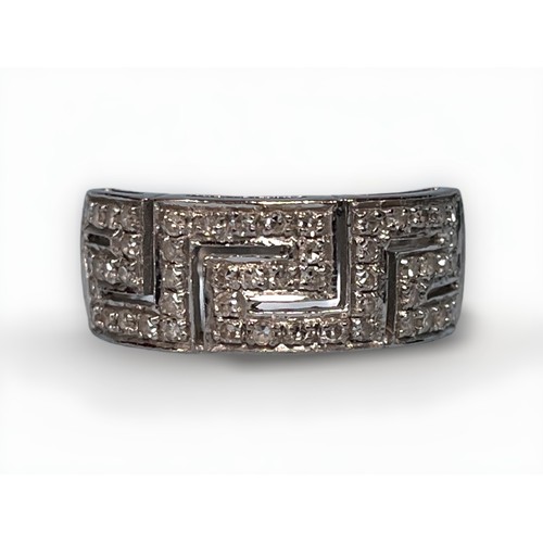 135 - An 18ct white gold ring, with Greek key design to top set with small diamonds, gross weight approxim... 
