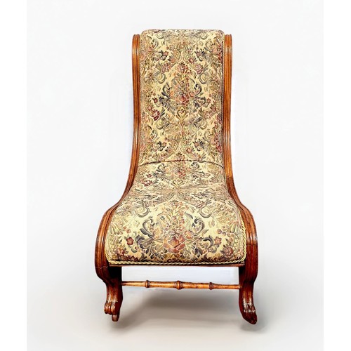 503 - A Victorian stained walnut spoon-back nursing chair with green velvet upholstery, on turned supports... 