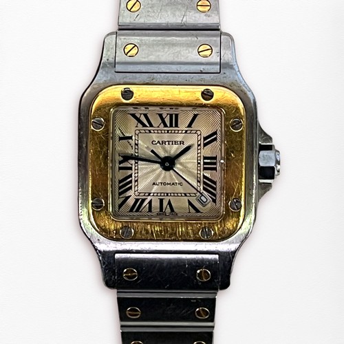 111 - A ladies stainless steel and gold automatic Cartier Santos wristwatch, model 2423, the square guillo... 