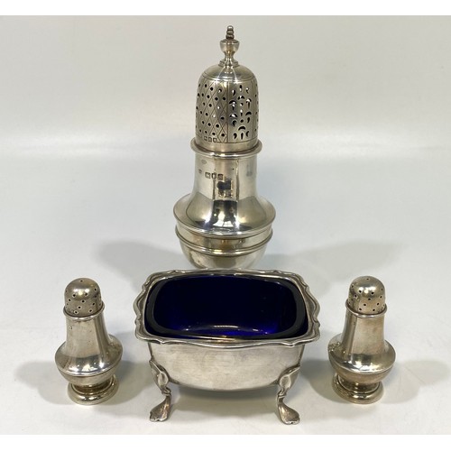 74 - A pair of Victorian silver baluster-shaped peppers, London, 1887, and silver baluster sugar caster, ... 