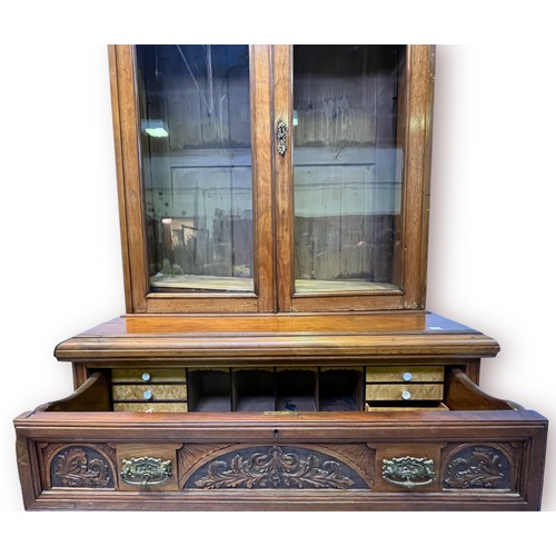 487 - A Victorian walnut Secretaire Bookcase, with glazed doors enclosing adjustable shelves, secretaire d... 