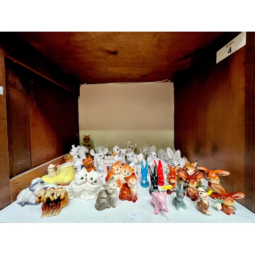 22 - A large quantity of assorted ceramic animal figures, comprising, five various Beswick cat figures, m... 